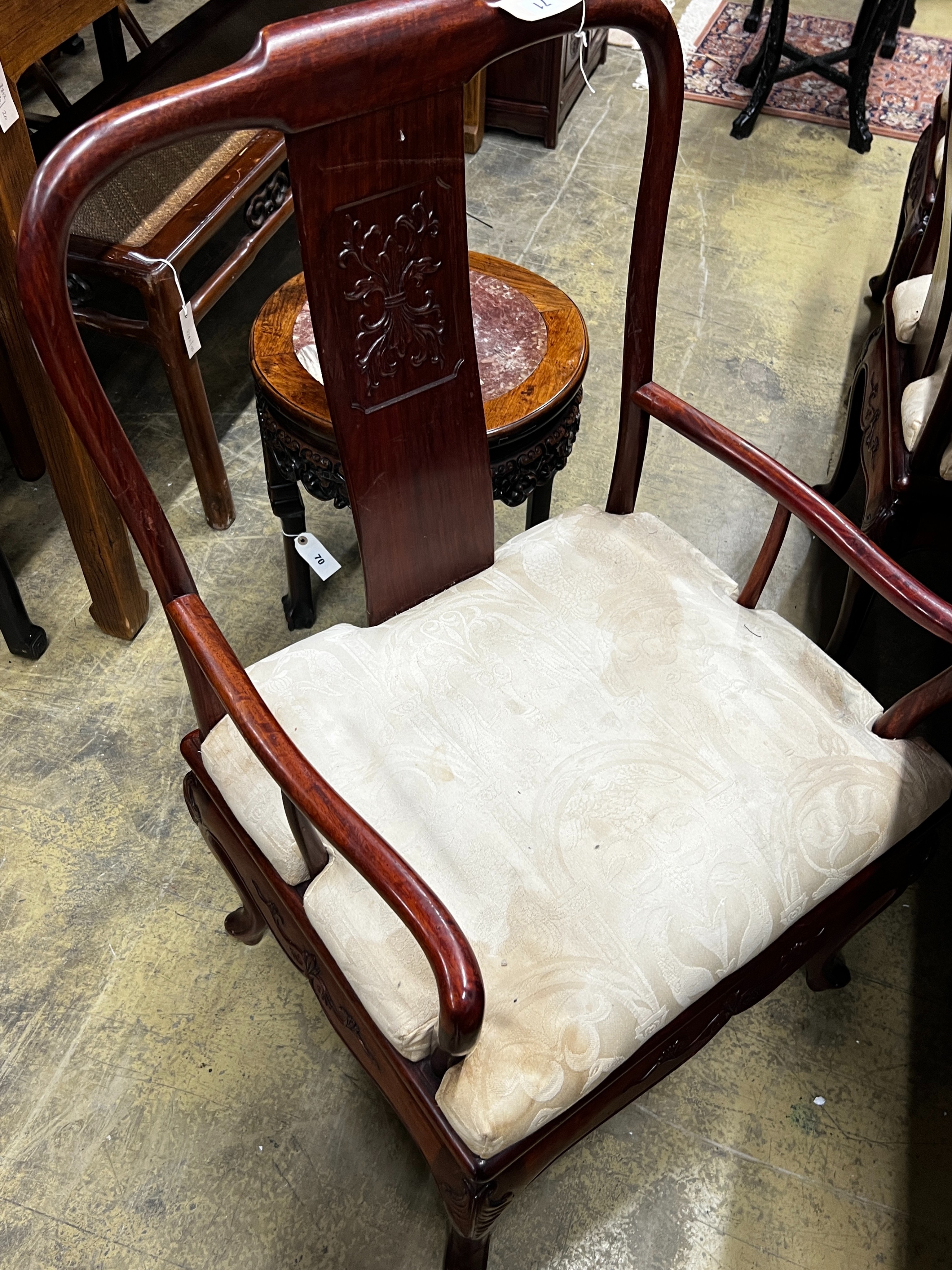 A Chinese hardwood extending dining table, length 244cm extended, two spare leaves, width 110cm, height 78cm and six chairs (2 with arms)